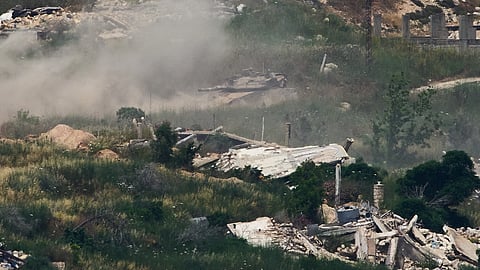 Israeli soldiers drive a tank in southern Lebanon as seen from northern Israel, Sunday, May 31, 2026.