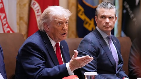 President Donald Trump speaks during a Cabinet meeting at the White House, Wednesday, May 27, 2026, in Washington, as Secretary of Defense Pete Hegseth, looks on.