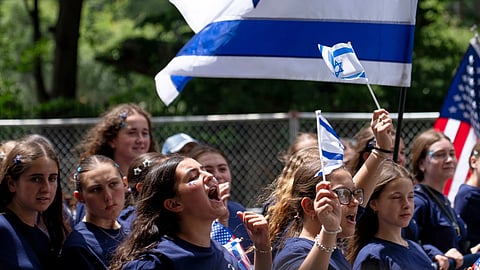 A parade participant cheers on the crowd during the Israel Day Parade, Sunday, May 31, 2026, in New York.