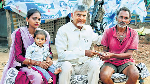 CM Nara Chandrababu Naidu handing over the NTR Bharosa pension to a toddy tapper at Chamavaram in Tuni constituency of Kakinada district on Monday