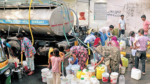 With piped supply failing, locals increasingly rely on water tankers (L) and purchased drinking water (above), turning a basic necessity into an expense.