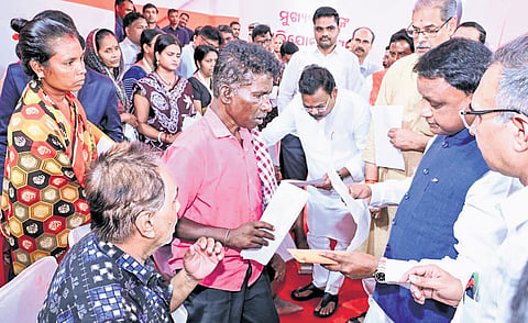 CM Mohan Charan Majhi looks into grievance petitions at the CM’s Grievance Hearing on Monday