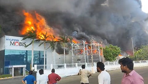 The fire spread rapidly to the main production unit, sending thick plumes of black smoke into the air