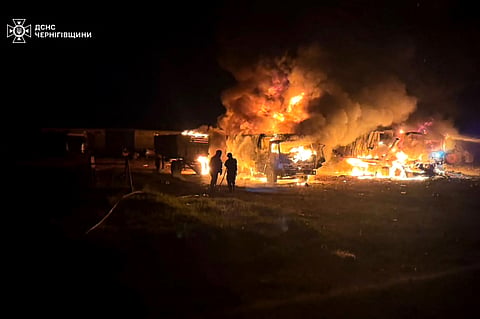 In this handout photograph taken and released by the Ukrainian Emergency Service on June 1, 2026, Ukrainian rescuers work to extinguish a fire at the site of an air attack at an undisclosed location in Chernigiv region, amid the Russian invasion of Ukraine.
