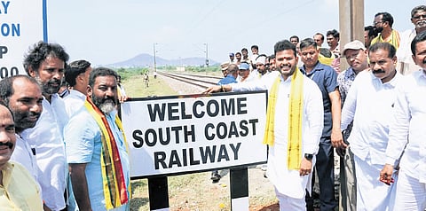 Union Minister Kinjarapu Ram Mohan Naidu unveils the South Coast Railway Zone name board at A.S. Peta railway track near Ichchapuram Railway Station