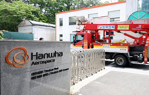 A vehicle of Korea Electric Power Corporation enters the main gate at the Hanwha Aerospace plant in Daejeon on June 1, 2026, after a reported explosion.