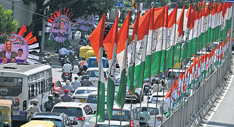 Race Course Road in city decorated with Congress flags and posters on Tuesday