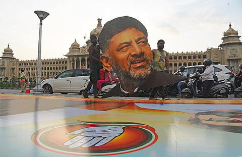 Structures getting ready for the posters in front of Vidhana Soudha and posters of designated CM DK Shivakumar ahead of swearing-in, in Bengaluru on Monday.