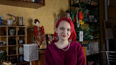 Vladislava Simonova, 27 years old, the haiku poet poses for a photo in her apartment in Poltava