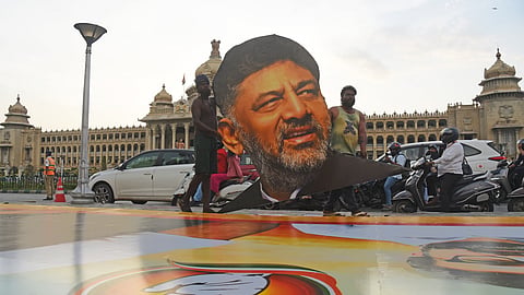 Structures getting ready for the posters in front of Vidhana Soudha and posters of designated CM DK Shivakumar ahead of swearing-in, in Bengaluru on Monday.