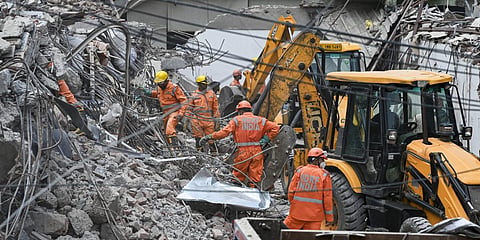 Large cranes have been deployed by authorities for debris removal at the crash site in Saidulajab