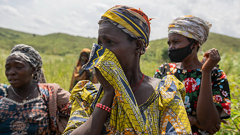 Family members of a victim who died from the Ebola virus mourn during the funeral at Rwampara Cemetery, in Rwampara, Congo, Saturday, May 23, 2026.