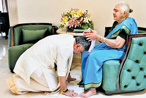DK Shivakumar seeks the blessings of his mother Gowramma before taking oath as chief minister in Bengaluru on Wednesday.