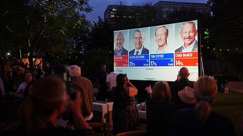 People watch results at an election night event for California gubernatorial candidate Xavier Becerra, Tuesday, June 2, 2026, in Los Angeles.