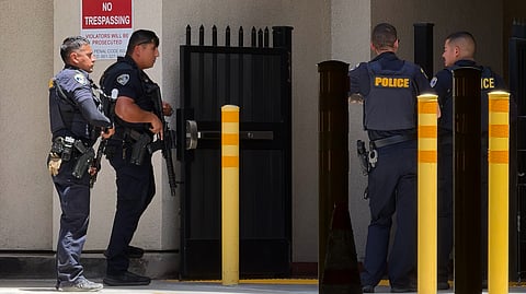 Police officers respond after a man barricaded himself inside a bank on Tuesday, June 2, 2026, in Bakersfield, Calif.