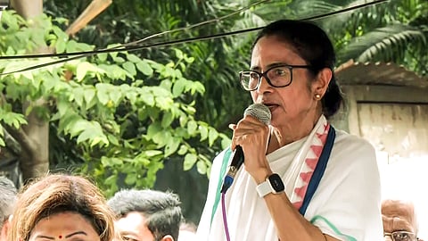 TMC Chief Mamata Banerjee speaks during a protest over post-poll violence, in Kolkata on Tuesday.