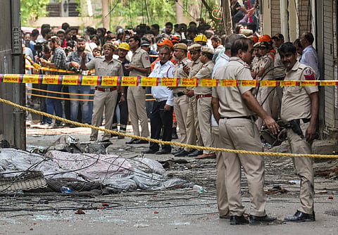 Police cordon off the area after a fire broke out at a bed-and-breakfast in a five-storey building in south Delhi's Malviya Nagar area, Wednesday, June 3, 2026.