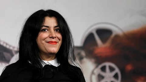 Director, illustrator and author Marjane Satrapi poses for photographers as she arrives to present the movie “La Bande des Jotas” at the 7th edition of the Rome International Film Festival in Rome, on Nov. 16, 2012.