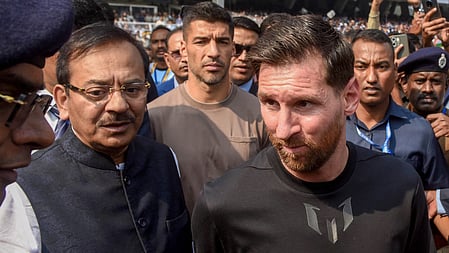 Ex-Bengal Minister Aroop Biswas with Lionel Messi at Salt Lake Stadium last year