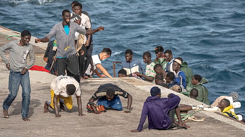 Migrants react as they arrive at the port in La Restinga on the Canary island of El Hierro, Spain, on, Aug. 19, 2024.