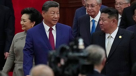 Chinese President Xi Jinping walks with North Korean leader Kim Jong Un, right, to a reception following a military parade to commemorate the 80th anniversary of Japan's World War II surrender held in front of Tiananmen Gate in Beijing, Wednesday, Sept. 3, 2025.