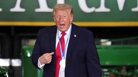 President Donald Trump wears a gold medal from Olympic speedskater Jordan Stolz at Custer Farms in Chippewa Falls, Wis., Friday, June 5, 2026.