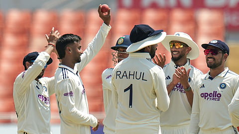 India's Manav Suthar, second left, with teammates celebrates after the wicket of Afghanistan's Rahmat Shah on day three of a Test cricket match between India and Afghanistan, in Mullanpur, Monday, June 8, 2026.