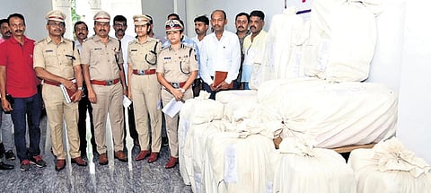 Police Commissioner Seema Latkar and other officials inspect ganja recovered in Mysuru on Monday