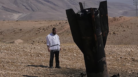 A man look at the wreckage of an Iranian missile that landed near the West Bank city of Jericho Monday, June 8, 2026.