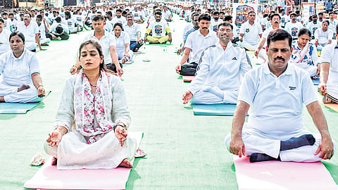 Home Minister Vangalapudi Anitha and NTR Police Commissioner SV Rajashekar Babu performing yoga in Vijayawada on Sunday