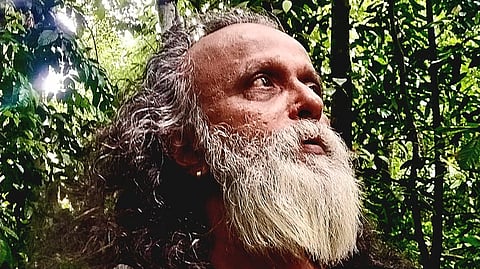 John Mathew in his land which he turned into a forest