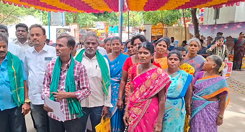 Kodaiyanchi villagers block standing outside the Vaniyambadi taluk office to submit a petition opposing the proposed drinking water pipeline alignment.