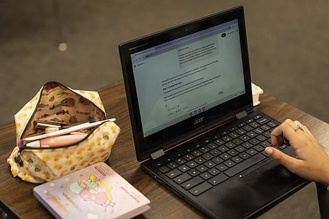 A student types a prompt into ChatGPT during class at a high school in California, US