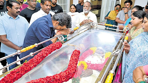 Chief Minister C Joseph Vijay paying his respects to veteran director Bharathiraja at his residence in Chennai on Wednesday.