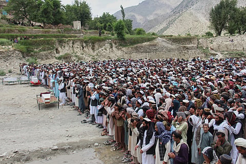 Mourners pray during a funeral for victims, including children, of airstrikes that Taliban officials said were carried out by Pakistan, in Mana, a village in Afganistan's Khost province, Wednesday June, 10, 2026.