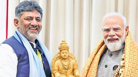 Karnataka Chief Minister DK Shivakumar presents an idol of Lord Basavanna to Prime Minister Narendra Modi in New Delhi on Thursday.