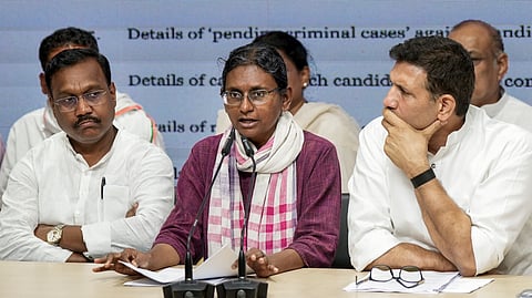 Congress leader Meenakshi Natarajan, centre, speaks as party leader Jitu Patwari, right, looks on during a party briefing at AICC office, in New Delhi, Friday, June 12, 2026