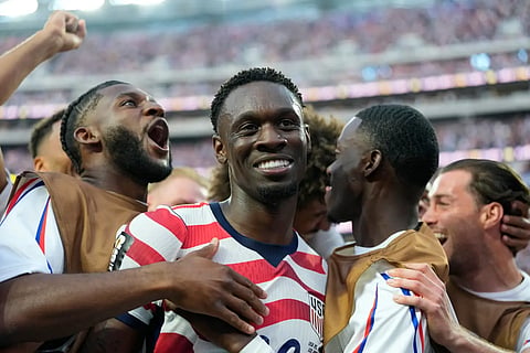 United States' Folarin Balogun, center, celebrates scoring his side's third goal against Paraguay with teammates during the World Cup Group D soccer match in Inglewood, Calif., near Los Angeles, Friday, June 12, 2026.