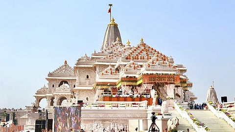 People attend the 'Dhwajarohan' ceremony at the Ram Temple in Ayodhya, Uttar Pradesh.