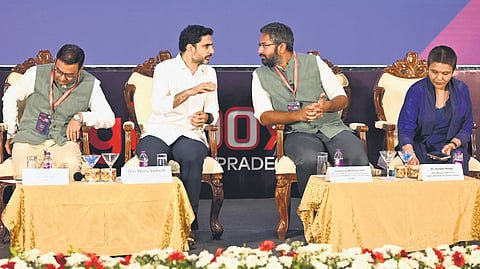 HRD & IT Minister Nara Lokesh shares a word with MP M Sribharat during Digii100X Summit in Visakhapatnam on Friday