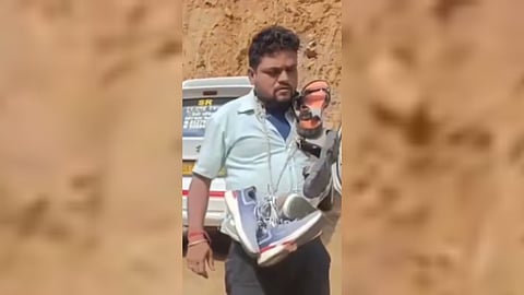 A viral video showing the taxi driver wearing a shoe garland following a spat with other taxi drivers.