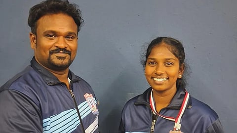 M Soundharya, who won a bronze medal in All India Inter-University Championship in Thang-Ta, with her coach Sandeep Kumar