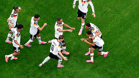 Germany's Jamal Musiala (10), lower right, is congratulated by teammates after scoring during the World Cup Group E soccer match between Germany and Curacao in Houston, Sunday, June 14, 2026.