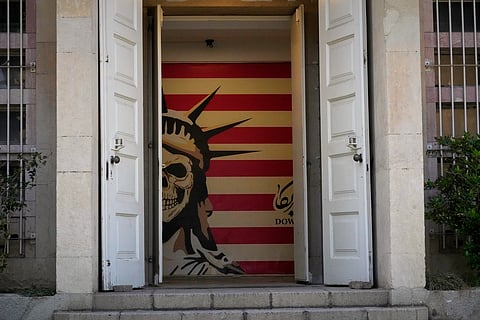 A satirised image of the Statue of Liberty and the U.S. flag decorate the entrance to the former U.S. Embassy, which has been turned into an anti-American museum, in Tehran, Iran, Friday, June 12, 2026.
