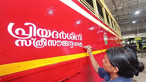 Painter Vishali puts the finishing touches to a KSRTC bus at the Central Workshop in Pappanamcode on Sunday ahead of the launch of the State government's Priyadarshini free travel scheme for women. The scheme is scheduled to be inaugurated at the KSRTC Central Depot, Thampanoor