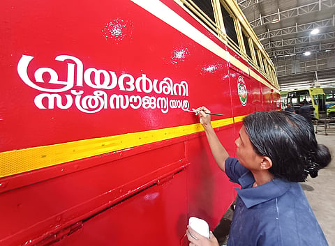 Painter Vishali puts the finishing touches to a KSRTC bus at the Central Workshop in Pappanamcode on Sunday ahead of the launch of the State government's Priyadarshini free travel scheme for women. The scheme is scheduled to be inaugurated at the KSRTC Central Depot, Thampanoor
