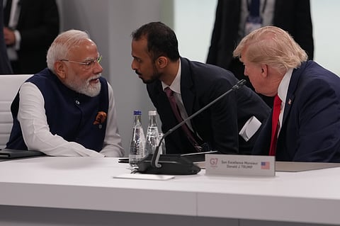 India's Prime Minister Narenda Modi talks to U.S. President Donald Trump before the plenary session at the G7 summit, Tuesday, June 16, 2026, in Evian-les-Bains, France.