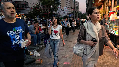 People walk along Tajrish square in northern Tehran, Monday, June 15, 2026.