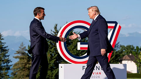 Emmanuel Macron, President of France, left, greets U.S. President Donald Trump during the G7 summit in Evian-les-Bains, France, Monday, June 15, 2026.