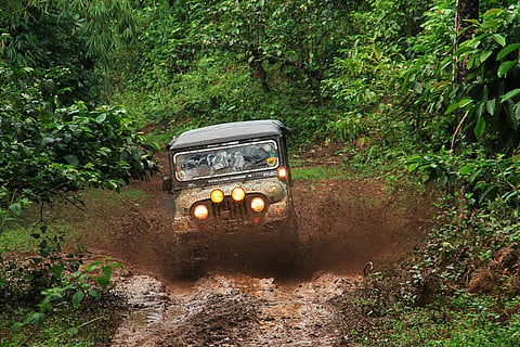 Jeep driver engaged in adventure sports